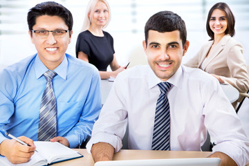 Fototapeta premium Happy business man with colleagues