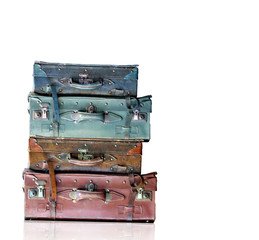 Vintage old travel bags isolated on white background