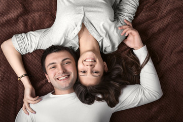 loving couple lying on the bed