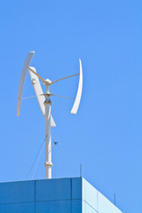 Vertical axis wind turbine on the top of building