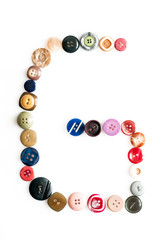 Letter alphabet formed of buttons