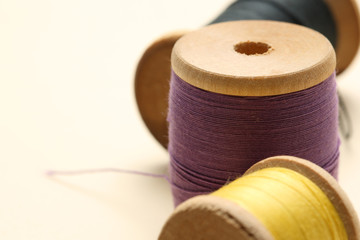 Thread bobbins on white background