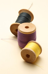 Thread bobbins on white background