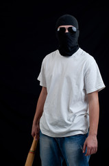 Young hooligan on dark background