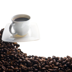 Coffee cup and grain on white background