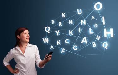 Young woman typing on smartphone with high tech 3d letters commi