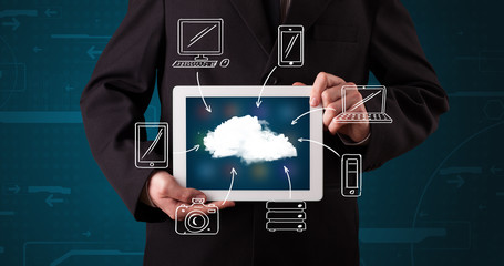 Businessman showing hand drawn cloud computing