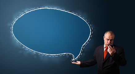 funny businessman holding a phone and presenting speech bubble c