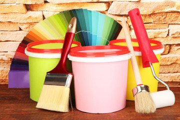 Set for painting: paint pots, brushes, paint-roller, palette of