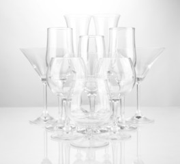 Cocktail and wine glasses, on gray background
