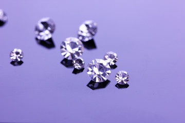 Beautiful shining crystals (diamonds), on purple background