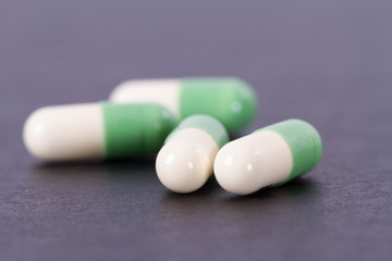 Green and White Medical Capsules