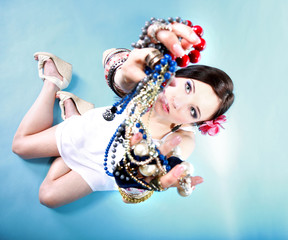 summer girl plenty of jewellery beads in hands