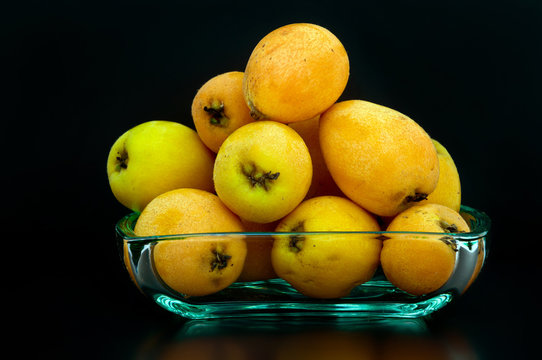 shesek ripe fruit on a black background