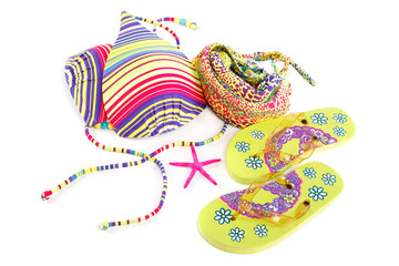 Fototapeta premium Women's swimsuit and flip-flops isolated on white background.