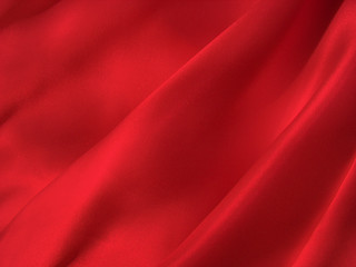 Fototapeta na wymiar Folded scarlet silk background