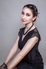 Asia girl with red nails and black beading