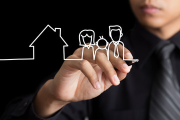 Businessman drawing family and a house