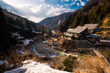 Naklejka premium River flows in the valley