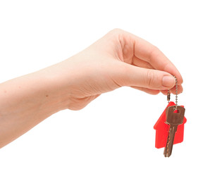 hand is handing a house key