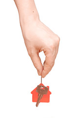 woman is handing a house key on a white background