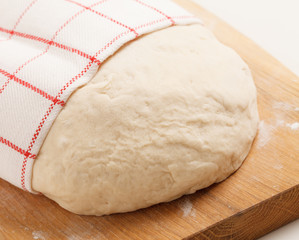 Dough on wooden board