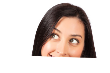 girl is looking out  behind a white sheet of paper