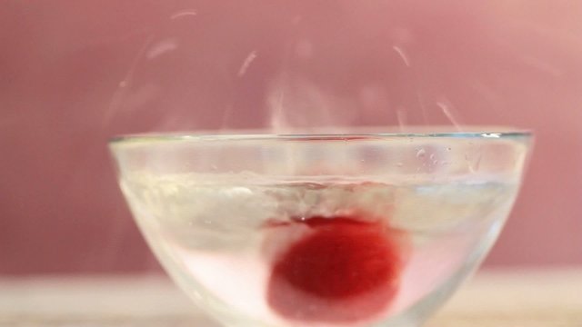 strawberries falling in fresh water