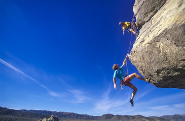 Climbers hanging over the void.