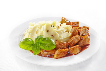 mashed potatoes and meat stew