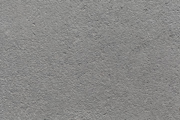 Close-up texture of gray urban asphalt road