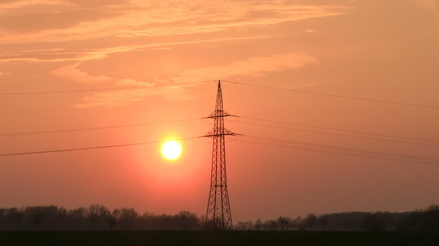 Sunset with electrical pylon (time lapse)