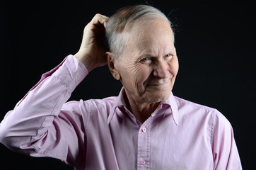 portrait of old man trying to remember