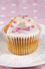 cupcake with icing and pink pearls
