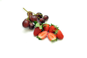 Strawberries and grapes isolated on white background