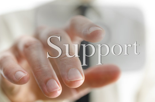 Male Hand Pointing At Support Icon On A Virtual Screen