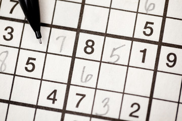 Sudoku puzzle and pencil
