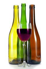 Bright colorful wine bottles and glass