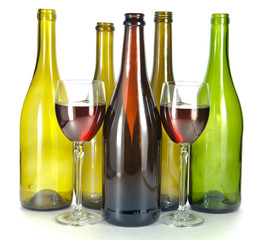 Bright colorful wine bottles and glass