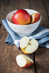 Composition with Red Cutting Apples on the wooden table