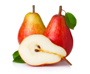 Ripe red pear fruits with green leaves isolated
