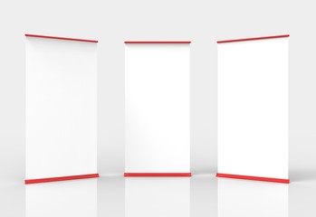 Three blank roll-up poster banner displays