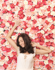 beautiful woman and background full of roses