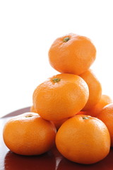 mandarin orange on japanese wooden tray
