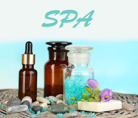 Beautiful spa setting on bamboo napkin on sky background