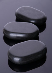 Hot spa stones on dark background