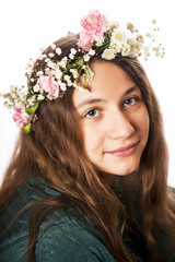Naklejka premium Portrait of the young girl with a wreath on the head