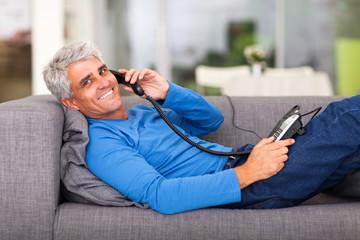 middle aged man talking on the telephone