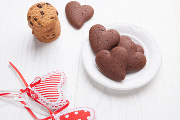 Heart shaped biscuits of chocolate with rustic cookies