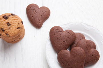 Heart shaped biscuits of chocolate with rustic cookies